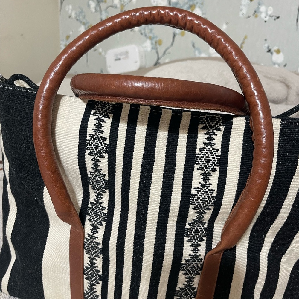 Elegant Black and White Striped Backpack with Brown Accents - Picture 3 of 9